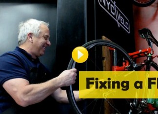 Greg Lemond fixing a flat tyre